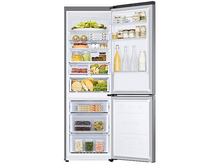 Charger l&#39;image dans la galerie, Un réfrigérateur avec la porte ouverte, rempli d&#39;aliments dans des récipients, bouteilles et tiroirs.
