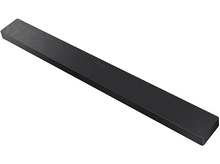 Charger l&#39;image dans la galerie, Une barre de son noire avec une surface rainurée, isolée sur fond blanc.
