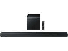 Charger l&#39;image dans la galerie, Une barre de son noire, un caisson de basses et une télécommande sur fond blanc.
