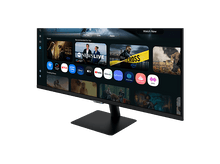 Charger l'image dans la galerie, Un moniteur Samsung noir affiche une interface Smart TV. Des icônes d'applications comme Netflix, Prime Video et Disney+ sont visibles.

