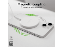 Charger l&#39;image dans la galerie, Un téléphone blanc est posé sur une surface, et un chargeur sans fil blanc est connecté. Des lignes vertes indiquent la charge.
