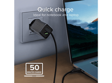 Charger l&#39;image dans la galerie, Chargeur noir branché dans une prise murale blanche, chargeant un ordinateur portable.
