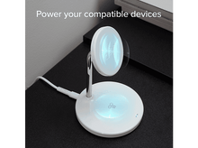 Charger l&#39;image dans la galerie, Un chargeur sans fil blanc sur une table noire, avec un cordon et du texte au-dessus.
