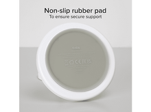 Charger l&#39;image dans la galerie, Base d&#39;appareil blanche avec coussinet gris et texte, montrant le dessous de l&#39;appareil.

