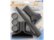 Buses d'aspirateur dans un emballage. Pièces en plastique noir de différentes formes et tailles. Ensemble 3 en 1.