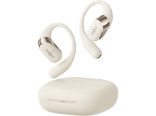 Charger l&#39;image dans la galerie, Écouteurs et étui crème. Les écouteurs flottent au-dessus de l&#39;étui. Le fond est uni.
