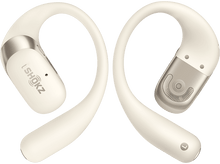 Charger l&#39;image dans la galerie, Deux écouteurs crème. Les écouteurs sont isolés sur un fond noir uni.
