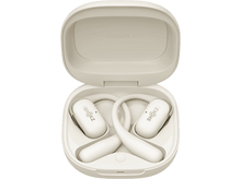 Charger l&#39;image dans la galerie, Écouteurs crème dans un étui crème. L&#39;étui ouvert affiche les écouteurs. Le fond est noir.

