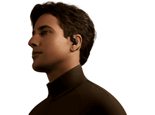 Charger l&#39;image dans la galerie, Un homme portant un écouteur sans fil noir. Il regarde sur le côté. Fond blanc.
