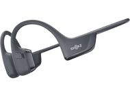 Casque à conduction osseuse gris foncé sur fond noir, avec un design incurvé et une marque.