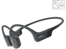 Charger l&#39;image dans la galerie, Casque à conduction osseuse gris avec le nom de la marque Shokz imprimé sur le côté.
