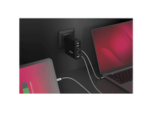 Charger l&#39;image dans la galerie, Un bloc de chargement noir avec plusieurs ports est branché sur une prise murale, chargeant une tablette et un ordinateur portable.
