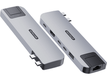 Charger l&#39;image dans la galerie, Deux appareils argentés avec des ports, probablement des hubs USB, sur un fond noir.
