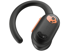 Charger l&#39;image dans la galerie, Écouteur sans fil Skullcandy noir avec des accents orange, porté par une boucle d&#39;oreille noire.
