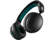 Casque Skullcandy noir, oreillettes noires, accents verts et jaunes, sur fond noir.