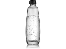 Charger l&#39;image dans la galerie, Une bouteille de soda en verre transparent avec des bulles à l&#39;intérieur. Elle a un bouchon noir et est sur une surface blanche.
