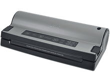 Charger l&#39;image dans la galerie, Une machine de scellage sous vide argentée et noire.
