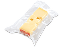 Charger l&#39;image dans la galerie, Tranche de fromage dans un emballage plastique transparent, isolée sur fond blanc.
