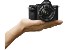 Charger l&#39;image dans la galerie, La main d&#39;une personne tenant un appareil photo Sony noir avec un objectif.
