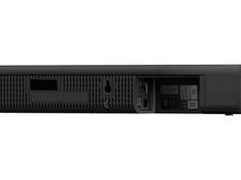 Charger l&#39;image dans la galerie, L&#39;arrière d&#39;une barre de son noire avec divers ports et options de connexion. La barre de son est sur fond blanc.
