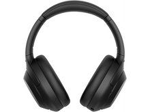 Charger l&#39;image dans la galerie, Casque audio noir circum-auriculaire. Les oreillettes et l&#39;arceau sont visibles. Le casque est sur fond blanc.
