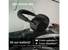 Charger l&#39;image dans la galerie, Casque noir sur surface réfléchissante. Texte indique 30 heures de batterie.
