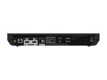 Charger l&#39;image dans la galerie, Arrière d&#39;un appareil noir avec ports HDMI et LAN. L&#39;appareil est sur une surface blanche.
