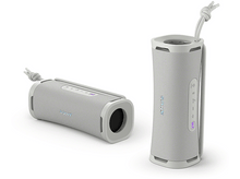 Charger l&#39;image dans la galerie, Deux enceintes Bluetooth Sony gris clair, une debout et une couchée.
