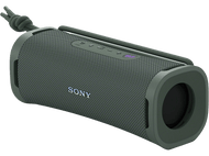 Haut-parleur cylindrique vert olive avec boutons et le logo Sony, placé sur une surface noire.