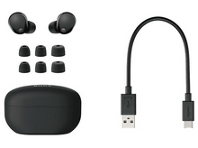 Charger l&#39;image dans la galerie, Écouteurs noirs, étui de chargement et câble USB-C sur fond blanc.
