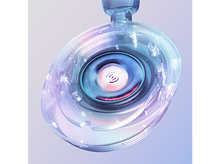 Charger l&#39;image dans la galerie, Gros plan d&#39;un haut-parleur de casque transparent avec un haut-parleur central bleu et rose.
