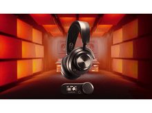 Charger l&#39;image dans la galerie, Casque noir avec module de contrôle. Fond rouge et orange éclairé en studio.
