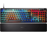 Un clavier avec des touches multicolores. Un repose-poignet est en dessous. La marque est SteelSeries.