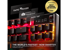 Charger l&#39;image dans la galerie, Un clavier de jeu avec des lumières rouges et des affichages pour les fonctions de déclenchement et de frappe rapides.
