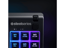 Charger l&#39;image dans la galerie, Gros plan sur un clavier SteelSeries avec touches éclairées, boutons de contrôle et logo SteelSeries.
