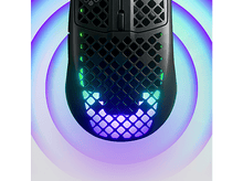 Charger l&#39;image dans la galerie, Souris de jeu noire avec des sections illuminées, entourée d&#39;un halo violet et bleu brillant.
