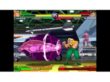 Charger l&#39;image dans la galerie, Un écran de jeu de combat. Un personnage effectue un mouvement, et l&#39;autre se défend.
