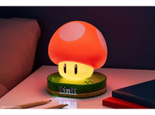 Charger l&#39;image dans la galerie, Lampe champignon Mario sur une table de chevet. Dessus rouge à pois blancs, base verte, horloge numérique.
