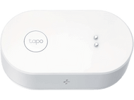 Un appareil blanc, ovale, avec un logo rond et deux boutons.