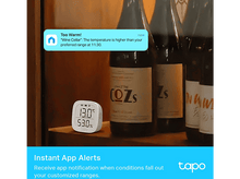 Charger l&#39;image dans la galerie, Un appareil domestique intelligent avec une bulle de notification au-dessus de bouteilles de vin.
