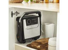 Charger l&#39;image dans la galerie, Appareil de cuisine dans un placard. Appareil noir et argenté, étagères en bois.
