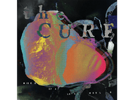Pochette de l'album The Cure : formes colorées abstraites, texte et fond sombre.