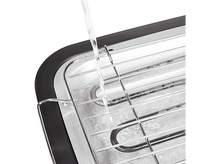 Charger l&#39;image dans la galerie, De l&#39;eau versée sur un grill électrique argenté, vu d&#39;un angle.

