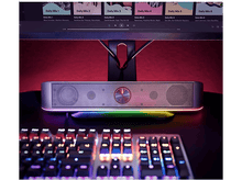 Charger l&#39;image dans la galerie, Barre de son avec bouton rouge, lumière colorée et clavier au premier plan.

