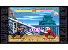 Charger l&#39;image dans la galerie, Deux personnages dans un jeu de combat, un noir et un rouge, se battant.
