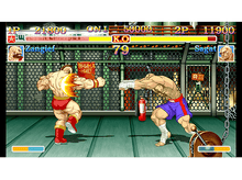 Charger l&#39;image dans la galerie, Scène de jeu vidéo de deux hommes musclés qui se battent, l&#39;un avec une tenue rouge.
