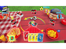 Charger l&#39;image dans la galerie, Scène du jeu Uno Party Mania, joueurs autour d&#39;une table de pique-nique avec de la nourriture et des cartes.
