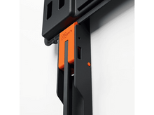 Charger l&#39;image dans la galerie, Gros plan d&#39;un support noir et orange fixé à un mur blanc.
