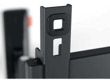 Charger l&#39;image dans la galerie, Gros plan sur un support métallique gris foncé avec des trous carrés et rectangulaires, fond blanc.
