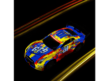 Charger l&#39;image dans la galerie, Une voiture de course jouet colorée avec un fond noir et des traînées de lumière.
